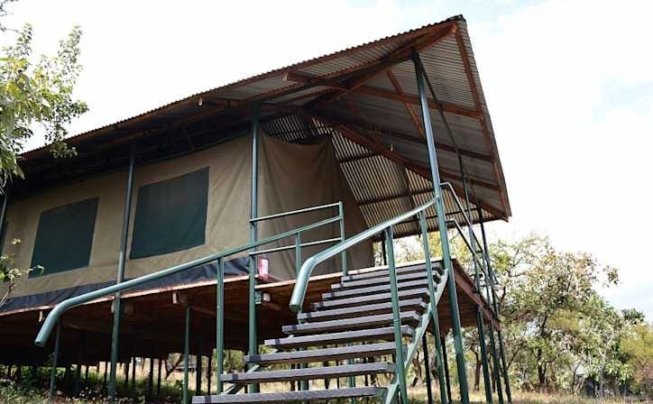 The veranda and steps of a safari lodge building